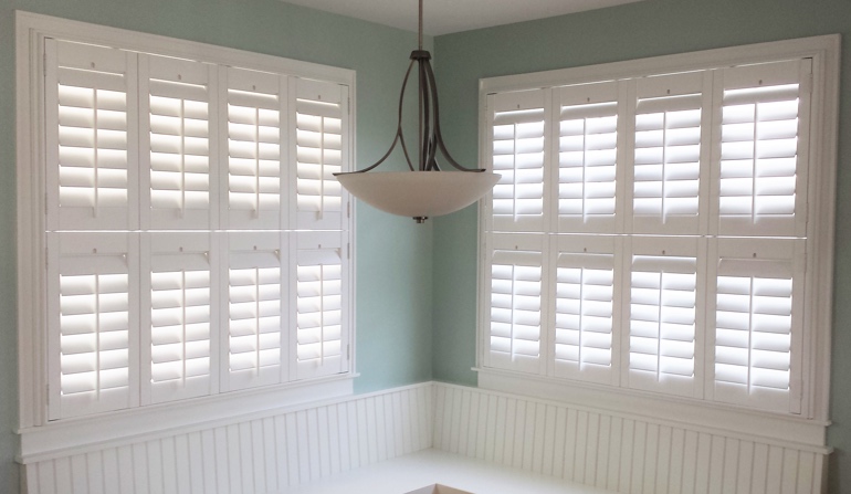 Soft green wall in Bluff City kitchen with shutters.